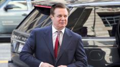 Paul Manafort arrives at court hearing about sentencing date in a wheelchair