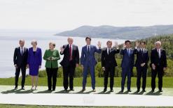 Germany's Merkel offers way to solve trade row at tense G7 summit