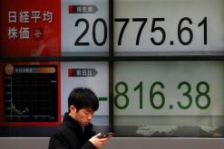 Asian shares stay near nine-month lows as trade frictions weigh