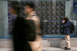 Asia shares edge higher, sterling slugged by UK politics