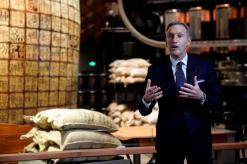 Starbucks' Schultz urges investor support despite China concerns