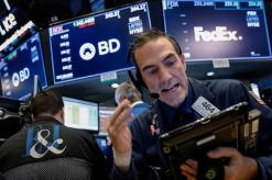 Wall Street flat as industrials offset slide in bank stocks