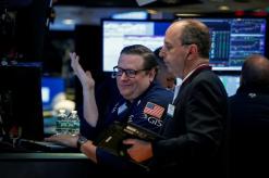 Trade data lifts U.S. dollar; stocks flat on mixed earnings