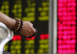 Asian shares edge lower as investors await China data
