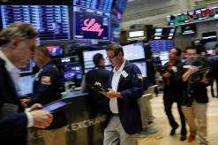 Wall Street opens flat as weak oil prices offset earnings enthusiasm