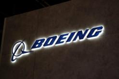 Boeing lifts industry demand forecast as air show deals role on