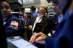 Wall Street opens flat as tech losses offset energy, Caterpillar gains
