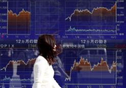 Asian shares rise on trade war relief as investors await data