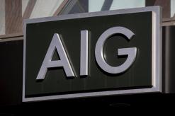 AIG shares slide 3 percent after executives downplay weak results