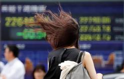 Asian shares on slippery slope as trade tensions take toll