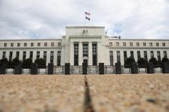 Fed raises rates, sees at least three more years of economic growth