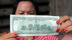 Currencies: Dollar holds steady after of retail-sales data
