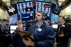 Wall Street rises at open after tame inflation data; Boeing turns higher