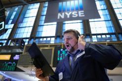 Tech boosts Wall Street; Boeing keeps Dow in check