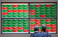 Asian shares flat as Fed looms, May's Brexit deal in chaos