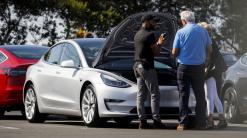 Tesla revives popular customer-referral program