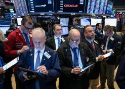 Wall Street ekes out gains as investors shrug off Fed minutes