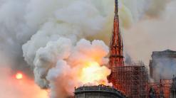 The Margin: Notre-Dame’s spire collapses as fire and smoke engulf the Paris cathedral