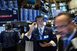 Wall Street edges higher on generally upbeat earnings