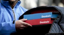 Stocks making the biggest moves midday: AT&T, Domino's Pizza, eBay & more