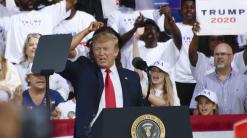 Key Words: Trump shares laugh with Florida crowd over rally attendee’s call to shoot migrants