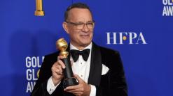 With laughs and tears, Hanks accepts Globes' DeMille honor