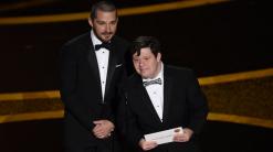 The Latest: Eminem surprises Oscars with 'Lose Yourself'