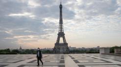 Parisians defy lockdown by dancing, briefly, in the street