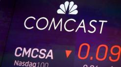 Comcast profit slides as pandemic hits movies, theme parks