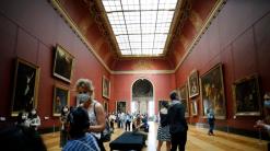 Mona Lisa back at work, visitors limited, as Louvre reopens