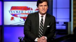 Fox's Carlson criticizes ex-writer, 'self-righteous' critics