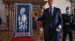 Italy returns stolen Banksy to France on Bastille Day