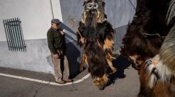 AP PHOTOS: Beast-like 'Carantoñas' return to Spanish town