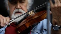 Cajun fiddler Michael Doucet breaks hip on tour in Alaska