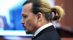 Johnny Depp takes stand in suit against ex-wife Amber Heard