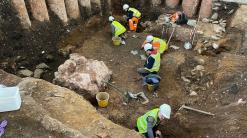Roman shrine uncovered beneath graveyard in central England
