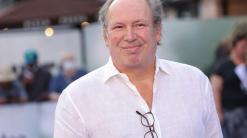 Film composer Hans Zimmer proposes to his partner on London stage, prompts raucous audience response
