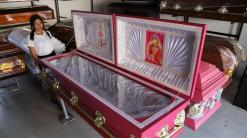 A funeral home in El Salvador offers pink coffins with Barbie linings