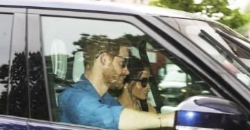 Prince Harry and Meghan Markle can&#039;t stop smiling as they arrive at Kensington Palace after wedding