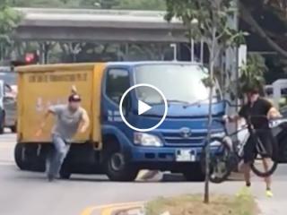 Agressive driver tries running over cyclist before paying for it with his face (Video)