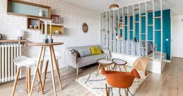 Parisian micro-apartment incorporates space-dividing 'library wall'
