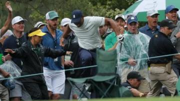 Tiger Woods roars into Masters contention despite being tripped