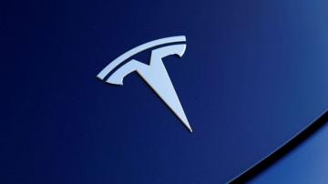 Tesla stock tumbles after reaching historic highs
