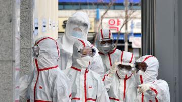 Virus crisis ebbs in China, spreads fear across the West