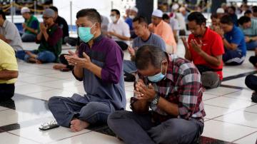 Pandemic increasingly takes over daily lives, roils markets