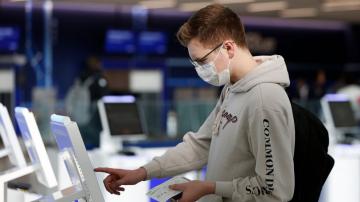 European arrivals jam some US airports amid virus screenings