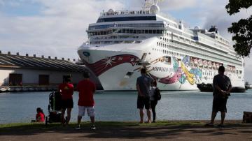 Troubled cruise ship with 2,000 passengers docks in Honolulu