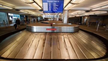 Many airline flights nearly empty as virus undercuts travel
