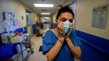 AP PHOTOS: For Milan nurse, virus patients enter the soul