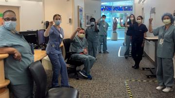 Hospital reinstates suspended nurses who demanded masks